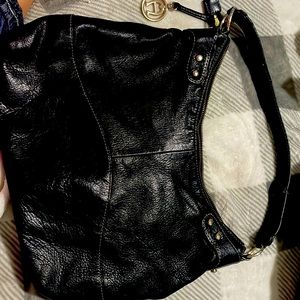 Etienne black leather purse in good condition